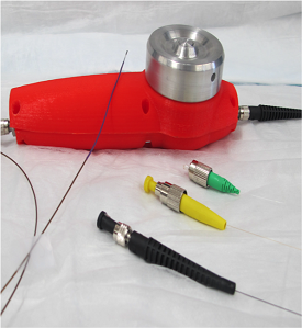 Prototype falloposcope, showing handle (red), optical connections (black, yellow, green), and the 0.8mm diameter imaging tip. (Courtesy of Dr. Barton).